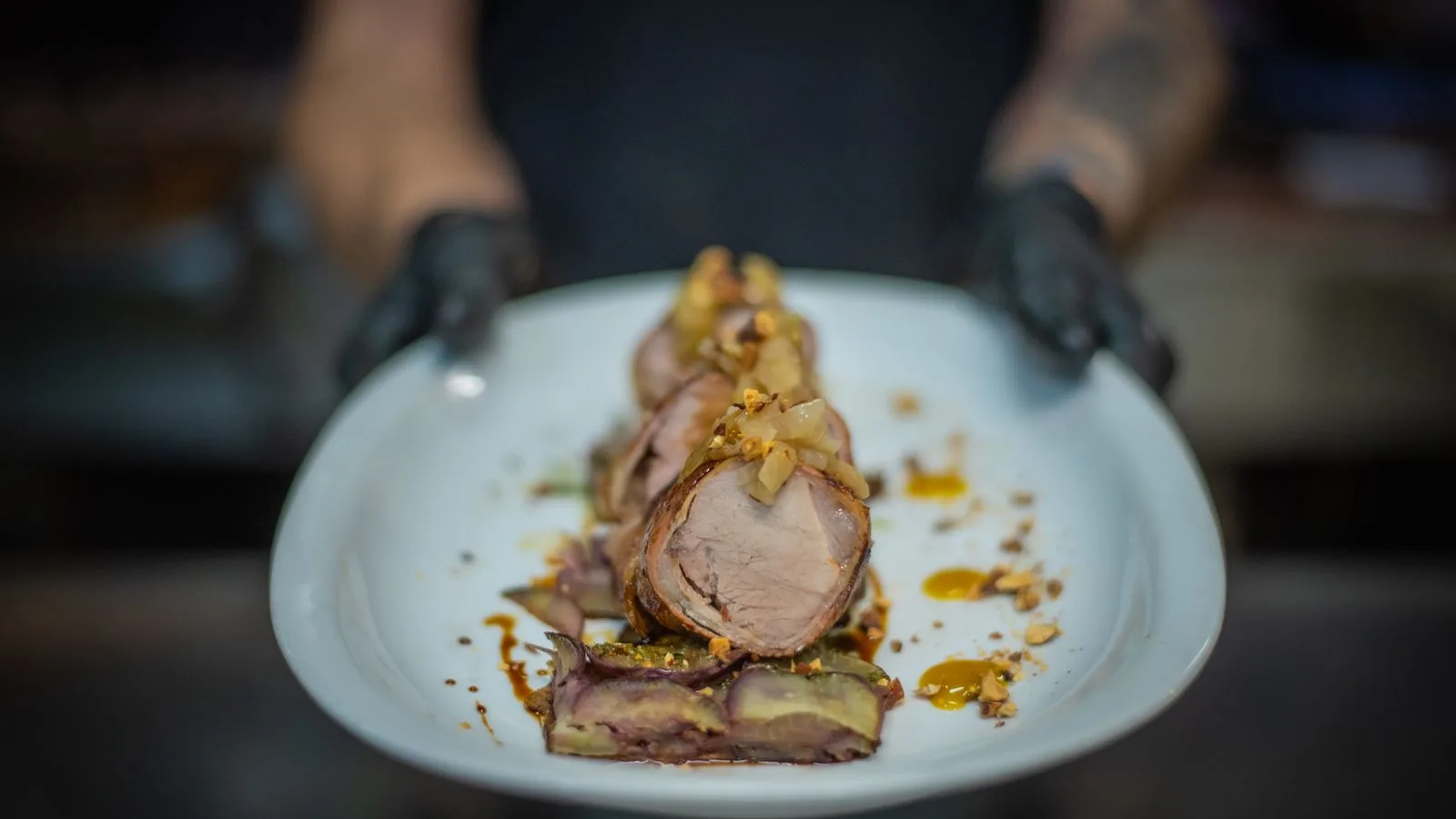 Expertly prepared gourmet pork dish, highlighting exquisite food presentation.
