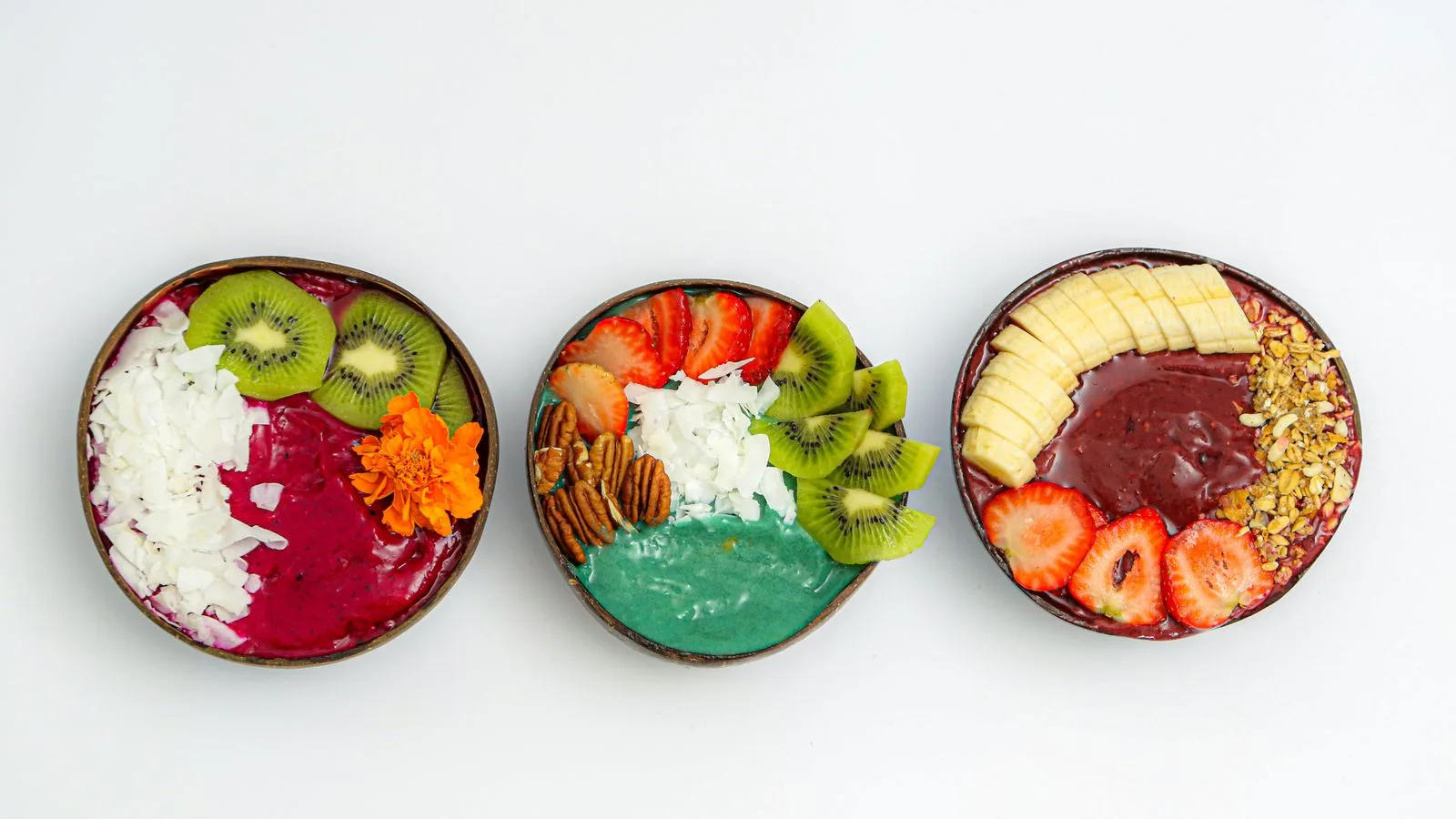 Delicious and colorful smoothie bowls topped with fresh fruits and nuts, capturing the essence of healthy eating.