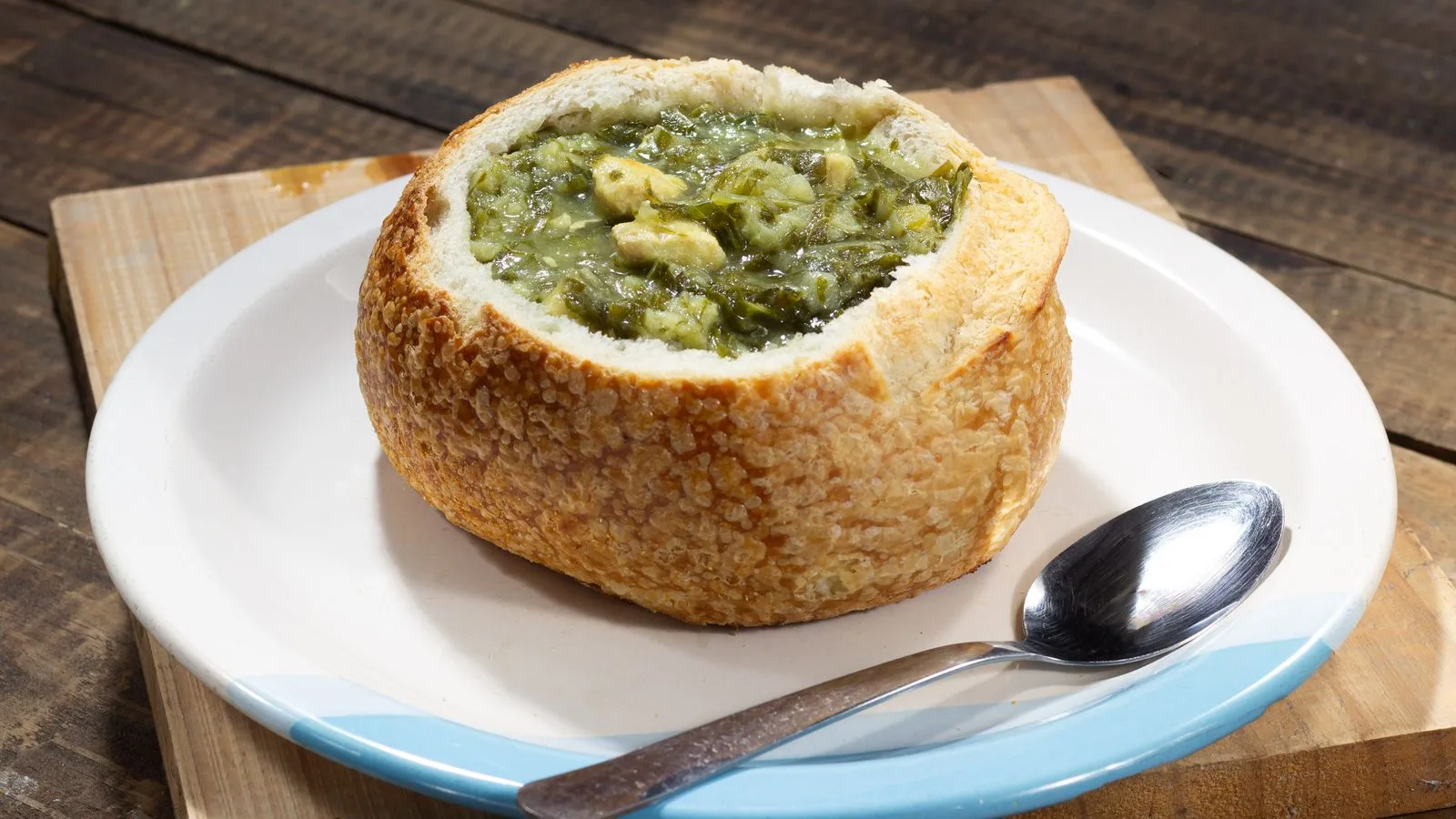 Savor a hearty soup served in a bread bowl, perfect for rustic dining experiences.