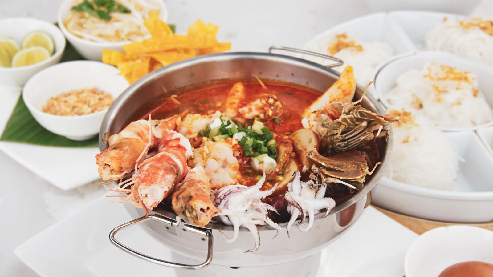 Delicious seafood hotpot with prawns, squid, and crabs in a spicy broth, ready to serve.