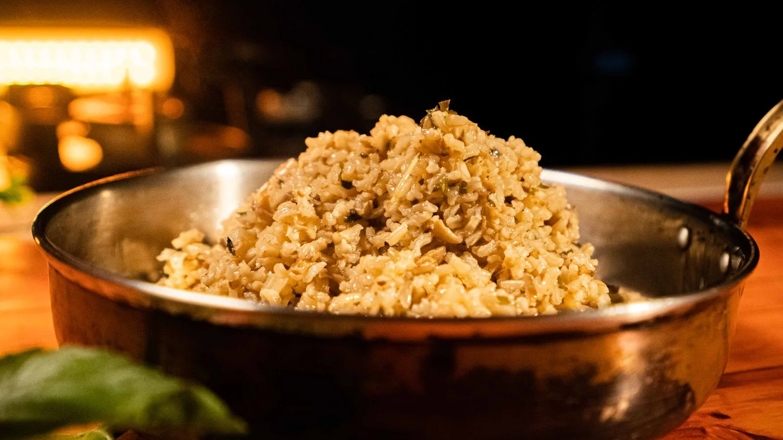 Delicious mushroom risotto served in a copper pan, perfect for a hearty meal.