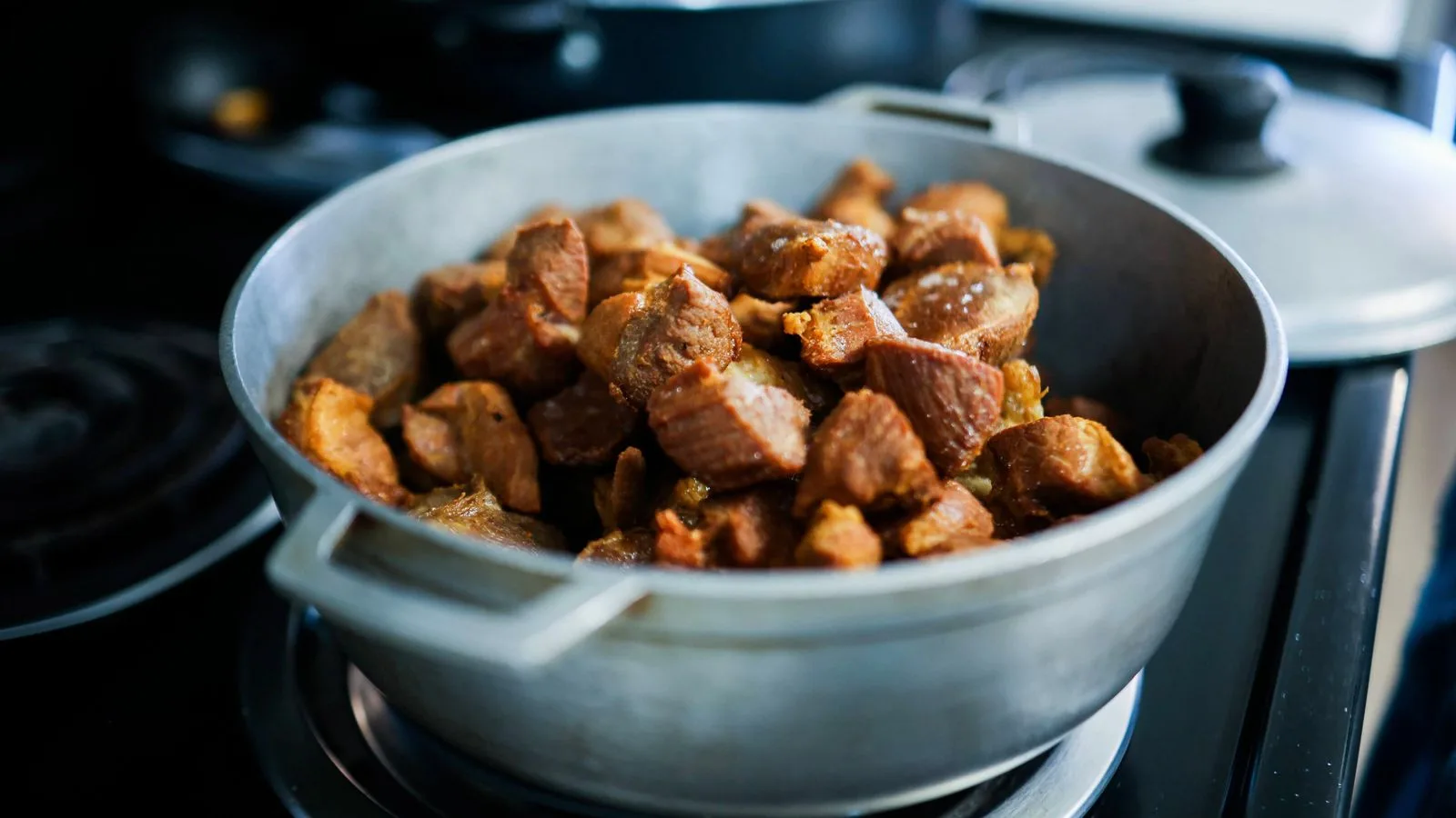 Hearty cooked meat pieces in a pot, perfect for home-cooked meals.