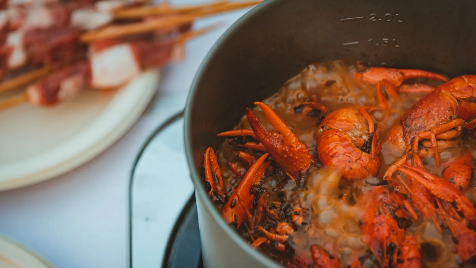 Steaming red crayfish bubbling in a pot, ideal for food enthusiasts.