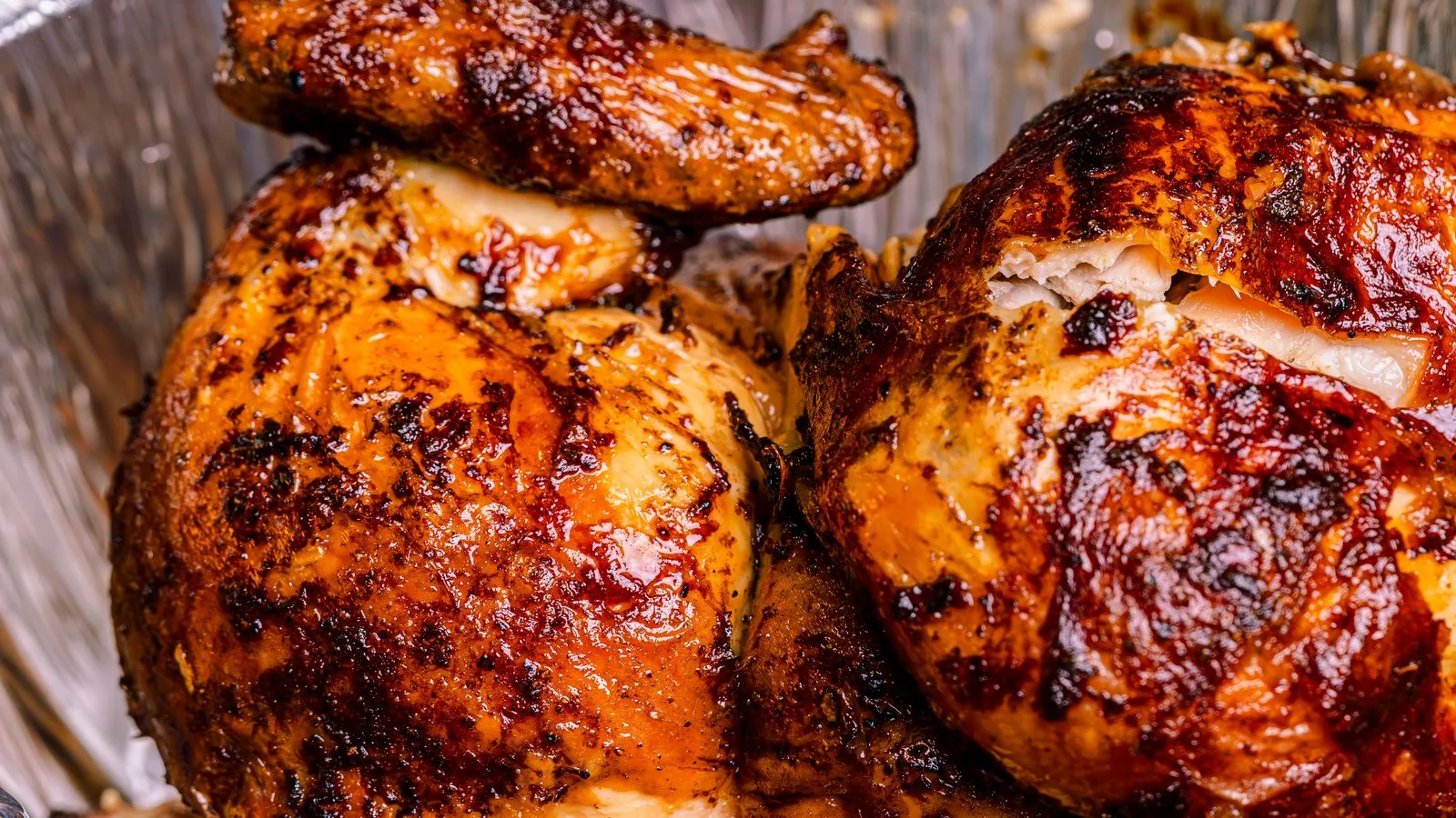 Deliciously roasted rotisserie chicken with crispy skin, perfect for a hearty meal.